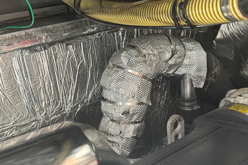 Slide: The Image of Engine compartment of a 2006 Princess V48 yacht with insulated piping. - 8