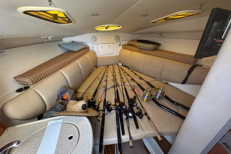 Slide: The Image of 2007 Hydra-Sports Vector 3300 VX cabin with fishing rods and cozy seating. - 33