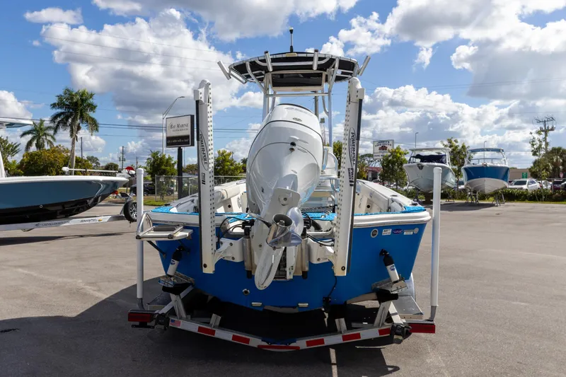 Slide: The Image of 2018 Sea Chaser 23 LX Bay Runner boat on trailer under blue sky. - 14