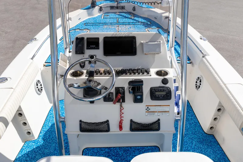 Slide: The Image of 2018 Sea Chaser 23 LX Bay Runner boat dashboard with steering wheel and controls. - 3