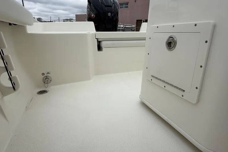 Slide: The Image of 2026 Pathfinder 2400 TRS boat interior, featuring storage compartment and clean deck design. - 3