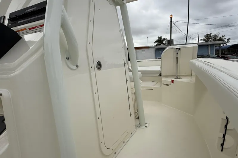 Slide: The Image of 2026 Pathfinder 2400 TRS boat interior, featuring sleek white design and modern amenities. - 5