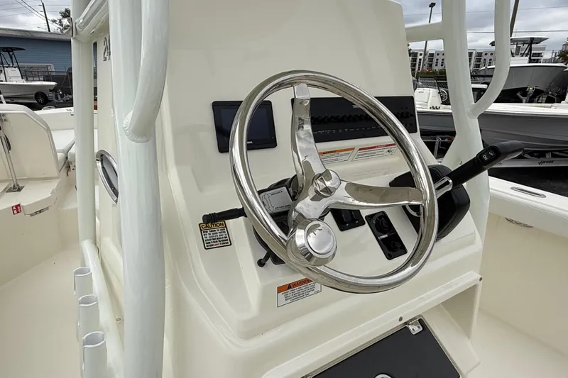 Slide: The Image of Steering console of 2026 Pathfinder 2400 TRS boat with modern controls. - 7