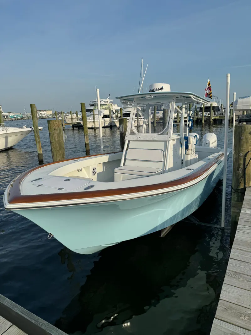 Slide: The Image of 2023 Valentino 28CC boat docked at marina. - 12