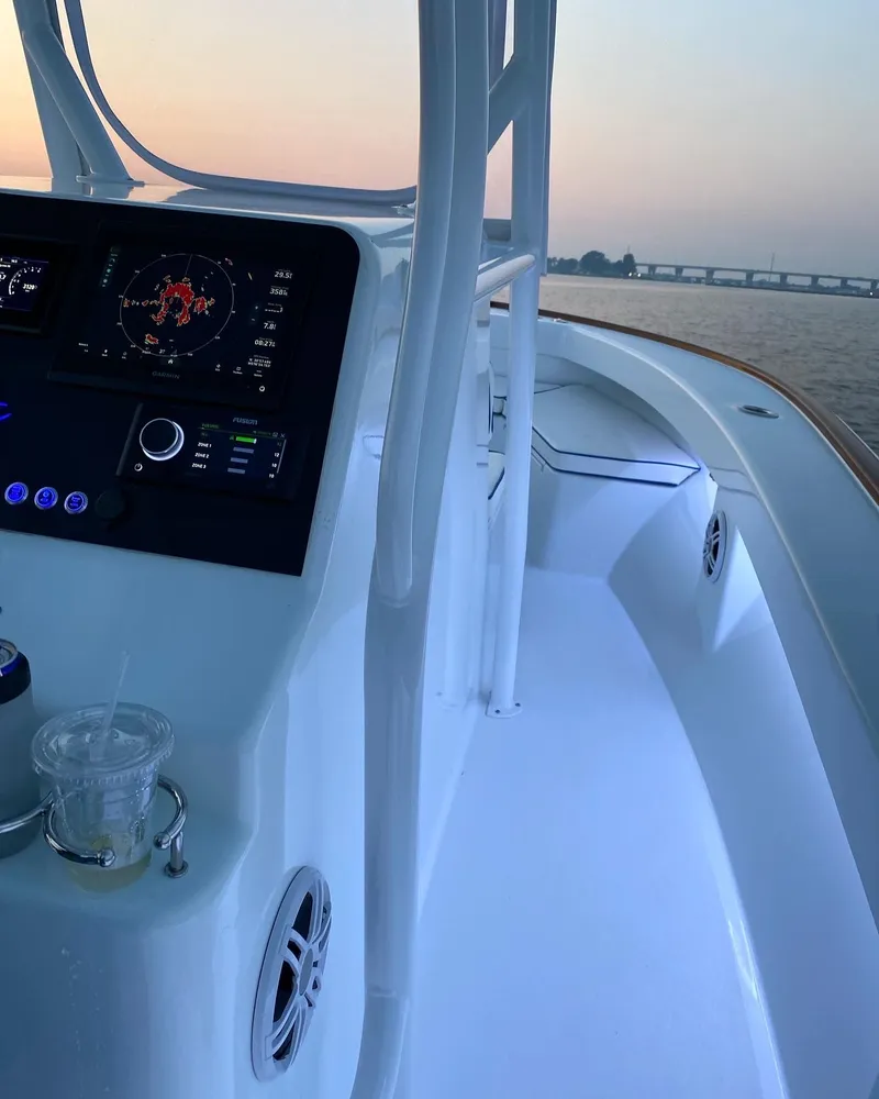 Slide: The Image of Valentino 28CC boat 2023 with modern helm console at sunset. - 18