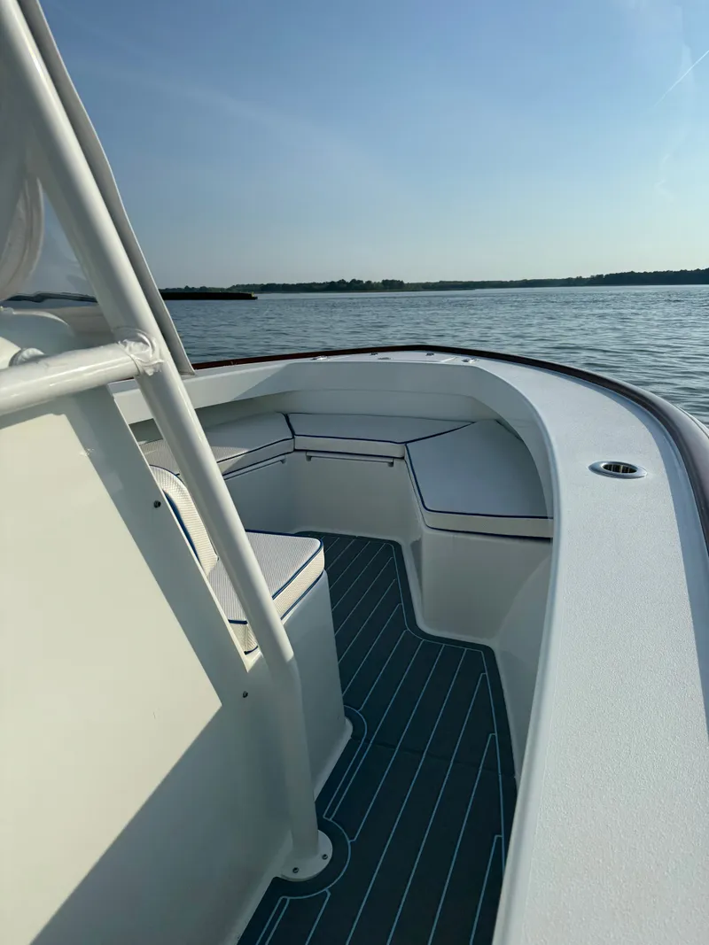 Slide: The Image of Valentino 28CC boat 2023 on calm water at sunset. - 20