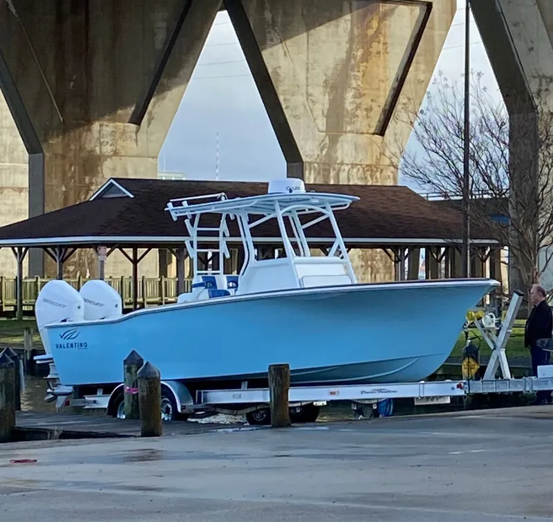 Slide: The Image of Valentino 28CC boat 2023 on trailer under bridge. - 29