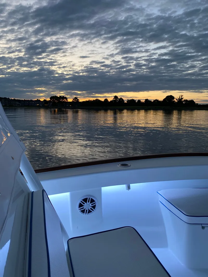 Slide: The Image of Valentino 28CC boat at sunset on calm waters, 2023 model. - 30