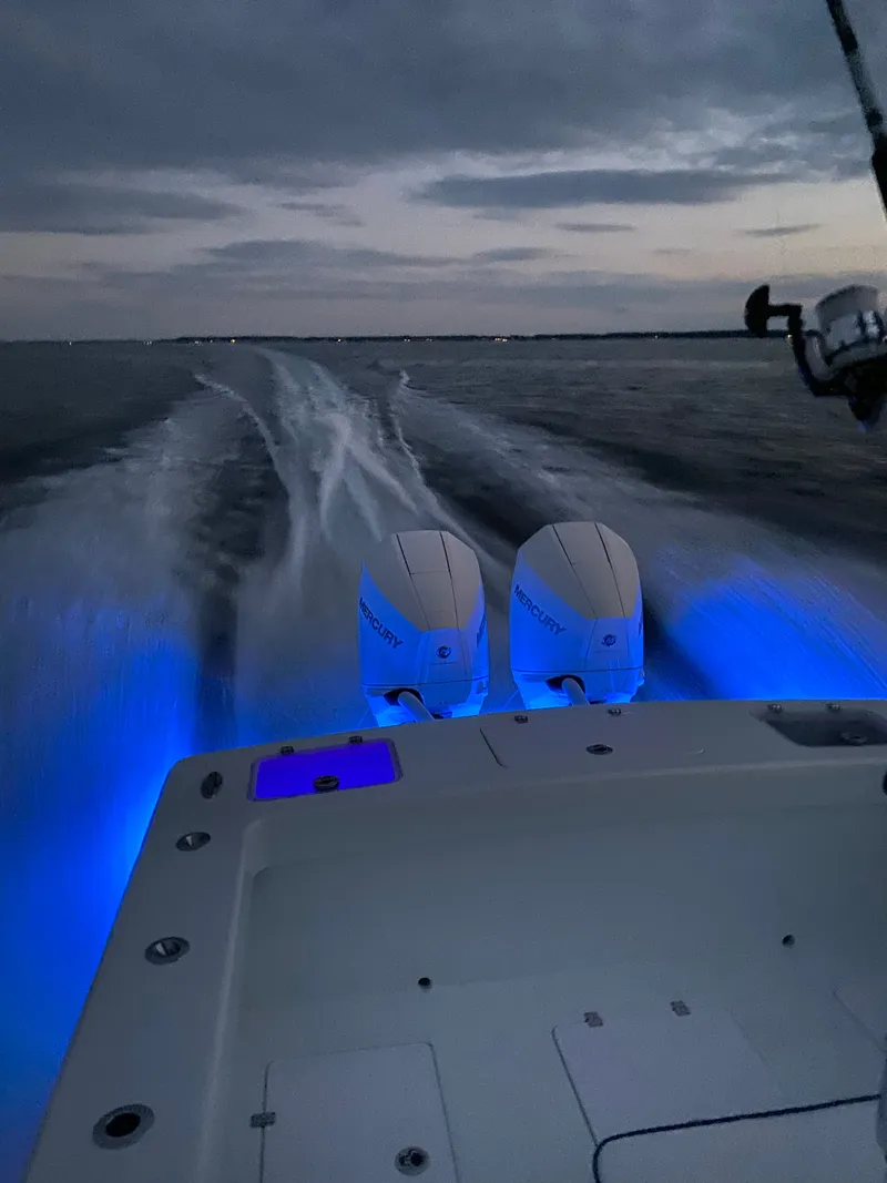 Slide: The Image of Valentino 28CC boat at night with blue lighting. - 35