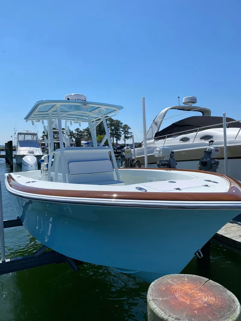 Slide: The Image of 2023 Valentino 28CC boat docked in sunny marina. - 4