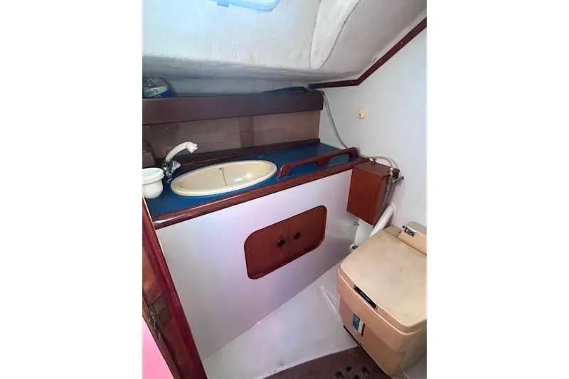Slide: The Image of Interior of 1987 Beneteau First 375 sailboat bathroom with sink and toilet. - 19