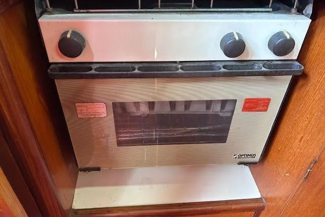 Slide: The Image of Vintage Optimus stove in a 1987 Beneteau First 375 yacht kitchen. - 28