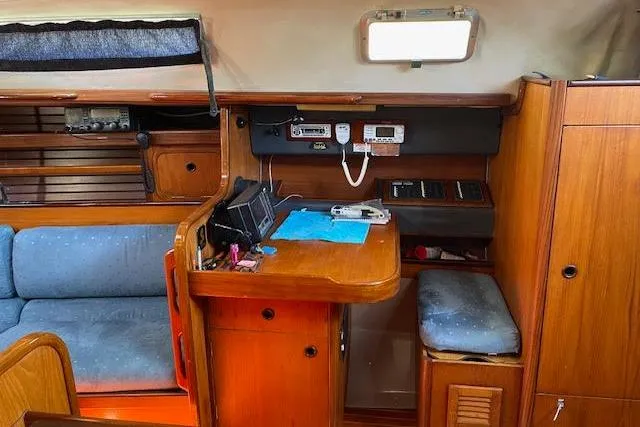 Slide: The Image of 1987 Beneteau First 375 yacht interior with navigation station and seating area. - 31
