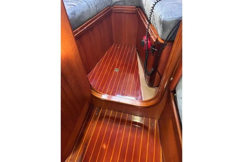 Slide: The Image of Interior of 1987 Beneteau First 375 sailboat with polished wooden flooring. - 34