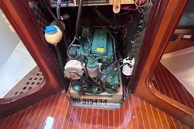 Slide: The Image of Engine compartment of a 1987 Beneteau First 375 sailboat, showcasing detailed mechanical components. - 47