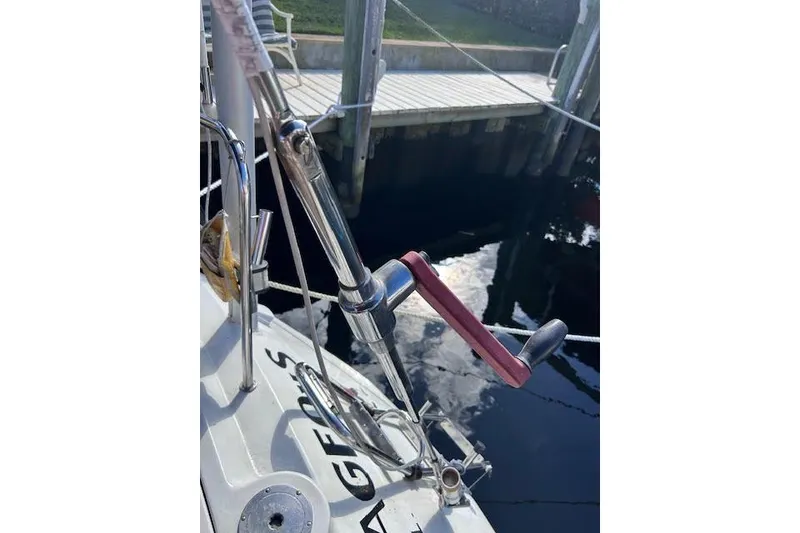Slide: The Image of Close-up of a 1987 Beneteau First 375 sailboat deck with winch handle. - 5