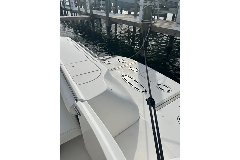 Slide: The Image of 2001 Sea Ray 480 Sedan Bridge yacht docked at marina, showing deck and mooring lines. - 17