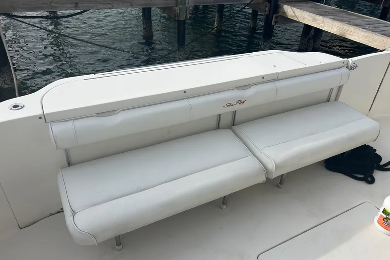 Slide: The Image of White seating on 2001 Sea Ray 480 Sedan Bridge yacht, dockside view. - 22