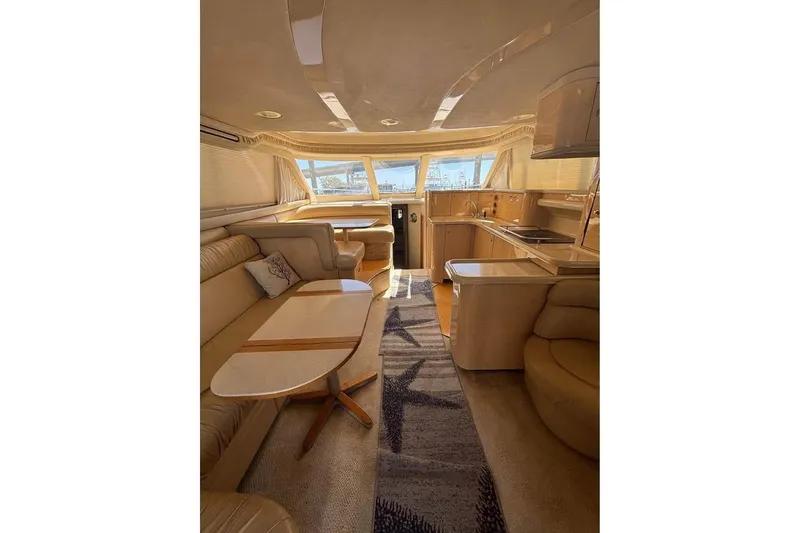 Slide: The Image of Luxurious interior of a 2001 Sea Ray 480 Sedan Bridge yacht with elegant furnishings. - 23