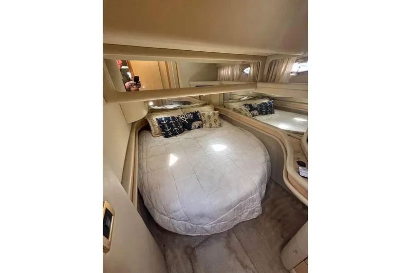 Slide: The Image of Cozy bedroom in 2001 Sea Ray 480 Sedan Bridge yacht with elegant bedding. - 40