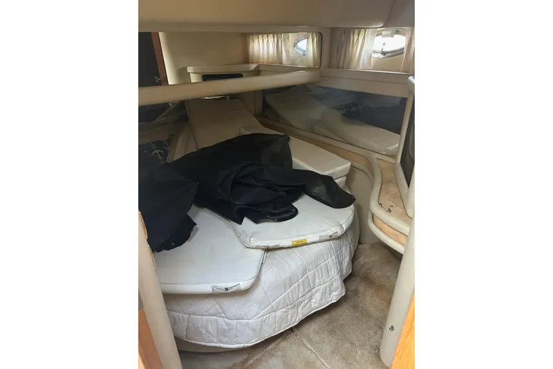 Slide: The Image of 2001 Sea Ray 480 Sedan Bridge cabin interior with bed and storage. - 44