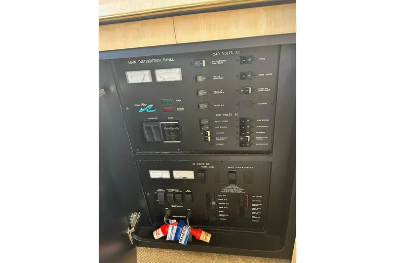 Slide: The Image of Electrical control panel on a 2001 Sea Ray 480 Sedan Bridge yacht. - 46