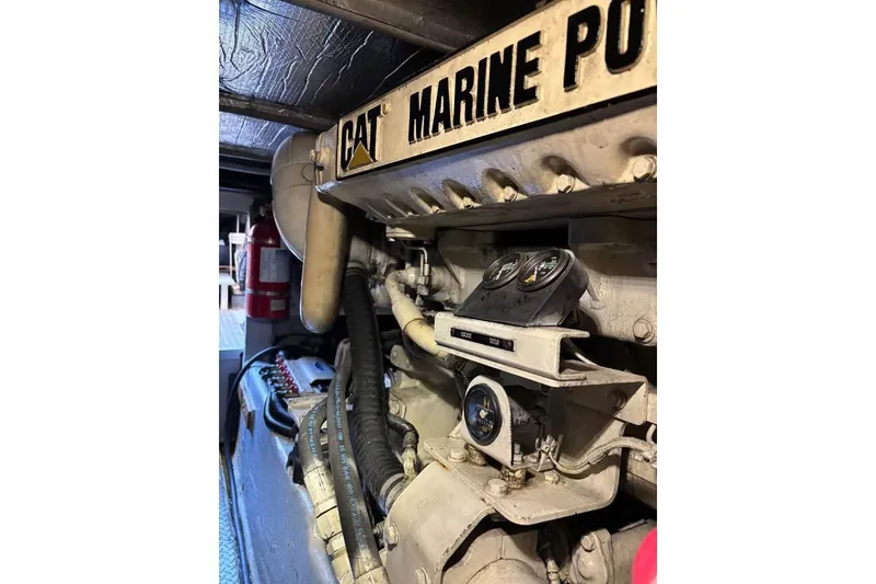 Slide: The Image of Engine room of 2001 Sea Ray 480 Sedan Bridge with CAT Marine Power engine. - 48