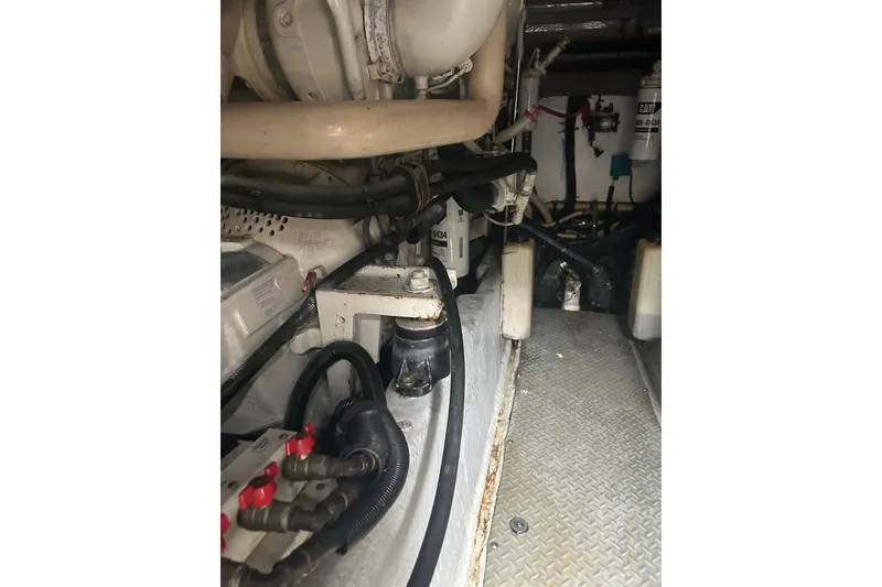Slide: The Image of Engine room of 2001 Sea Ray 480 Sedan Bridge with visible components and wiring. - 50