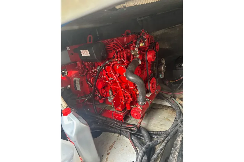 Slide: The Image of Red engine inside 2001 Sea Ray 480 Sedan Bridge boat. - 51