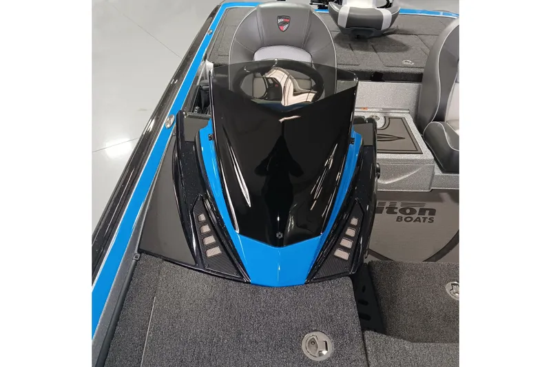 Slide: The Image of 2026 Triton 21XP Patriot boat interior with sleek black and blue design. - 10