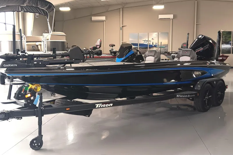 Slide: The Image of 2026 Triton 21XP Patriot boat in showroom, featuring sleek design and modern equipment. - 4