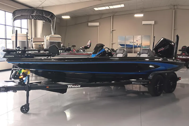 Slide: The Image of 2026 Triton 21XP Patriot boat in showroom, featuring sleek design and modern equipment. - 5