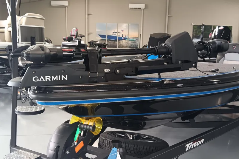 Slide: The Image of 2026 Triton 21XP Patriot boat with Garmin equipment in showroom. - 7