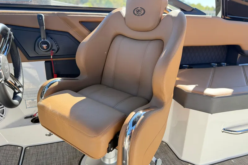 Slide: The Image of Luxurious interior of 2025 Cobalt R8 boat with tan leather seating and modern controls. - 12