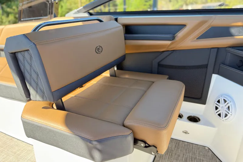 Slide: The Image of Luxurious interior seating of 2025 Cobalt R8 boat with tan and black upholstery. - 19