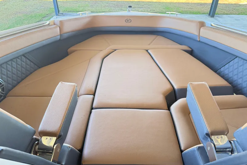 Slide: The Image of Luxurious interior of 2025 Cobalt R8 boat with tan leather seating and armrests. - 20