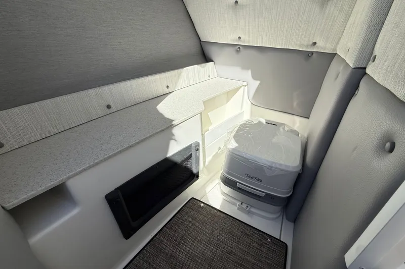 Slide: The Image of Compact interior of 2025 Cobalt R8 with portable toilet and storage space. - 23