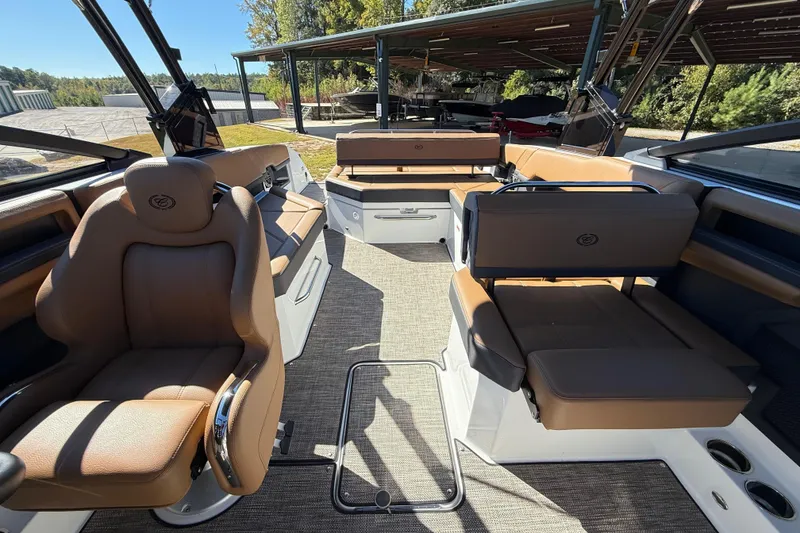 Slide: The Image of 2025 Cobalt R8 boat interior with luxurious brown seating and modern design. - 24