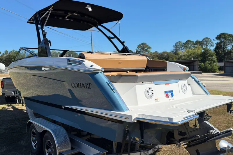 Slide: The Image of 2025 Cobalt R8 boat on trailer, sleek design, outdoor setting. - 6
