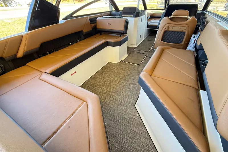 Slide: The Image of Luxurious interior of 2025 Cobalt R8 boat with tan leather seating and modern design. - 9