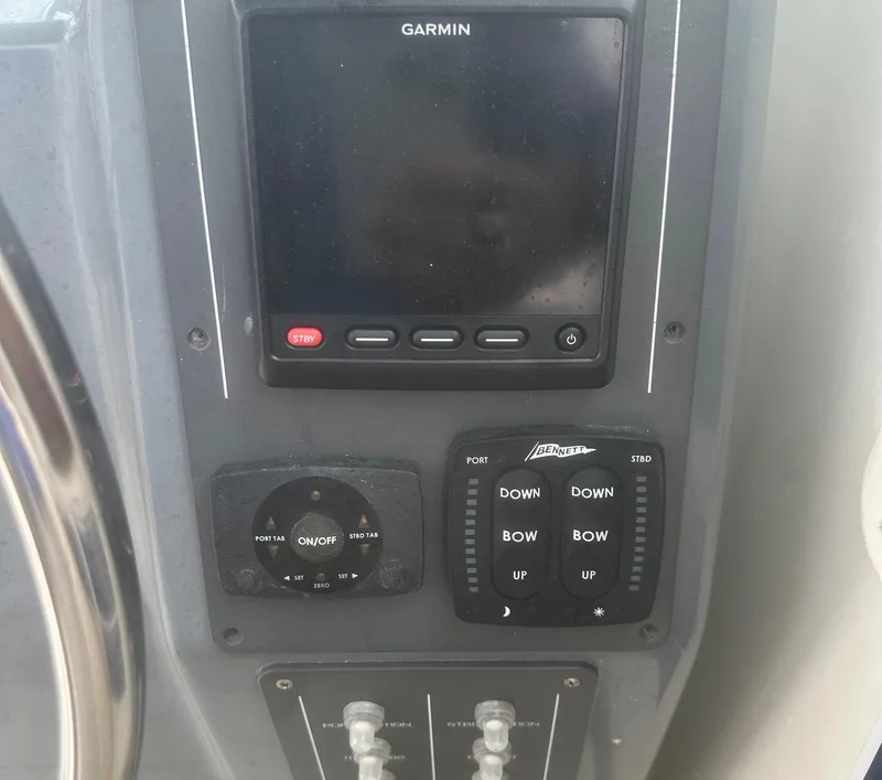 Slide: The Image of Dashboard of a 1995 Tiara Sport 3100 with Garmin navigation system. - 7