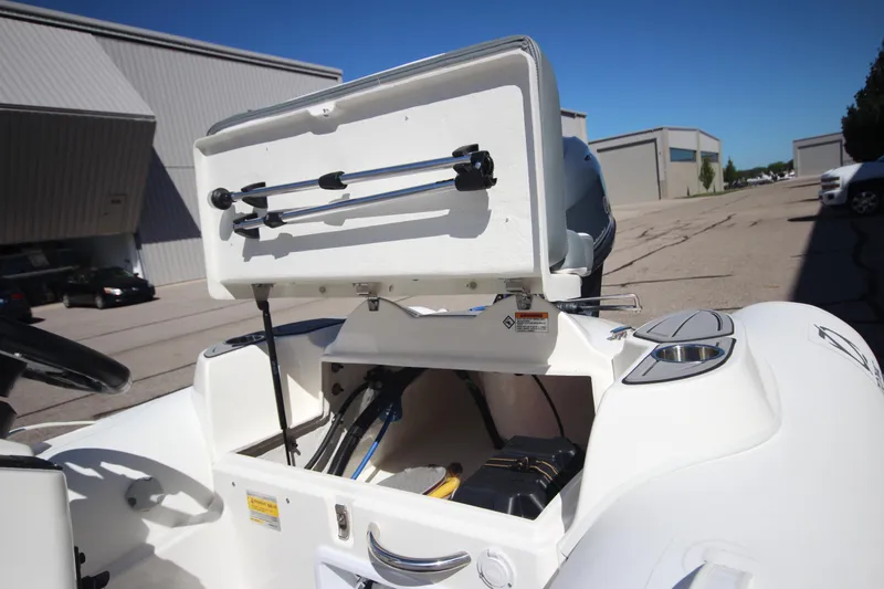 Slide: The Image of 2025 Zodiac Yachtline 360 DL NEO, open storage compartment, outdoor setting. - 5