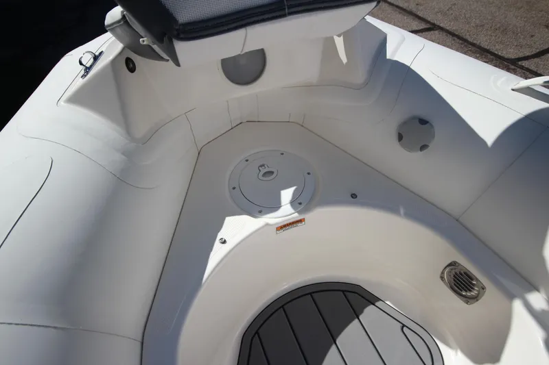 Slide: The Image of 2025 Zodiac Yachtline 360 DL NEO boat interior, white seating and flooring. - 11