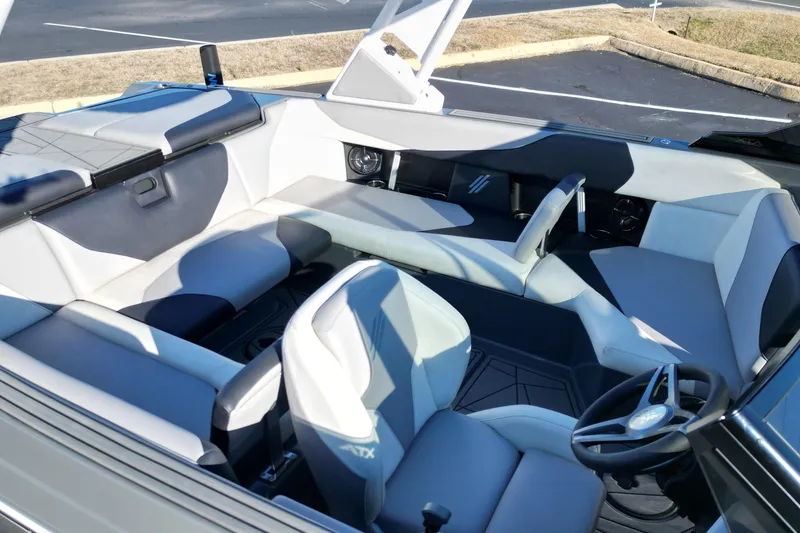 Slide: The Image of 2021 ATX Surf Boats 22 Type-S interior with modern seating and steering wheel. - 11