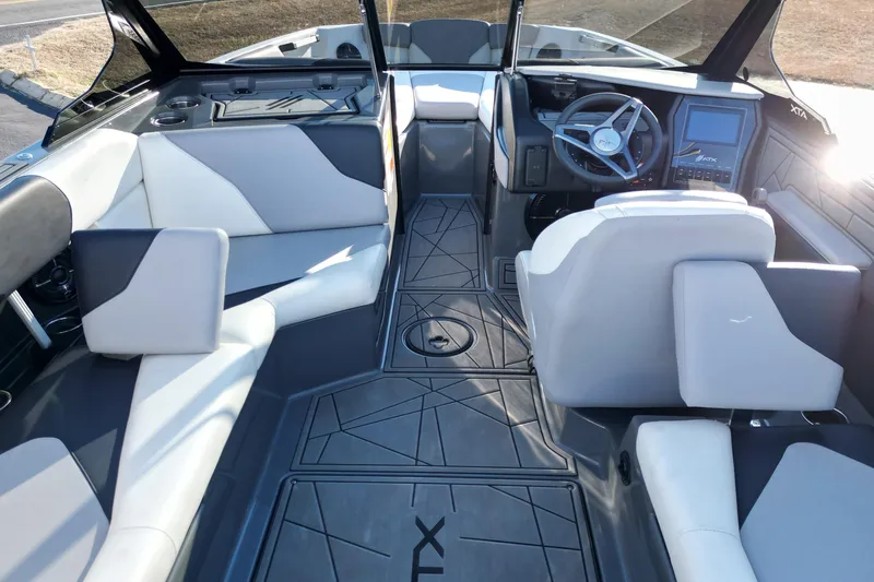 Slide: The Image of Interior of 2021 ATX Surf Boats 22 Type-S, featuring modern seating and dashboard design. - 14