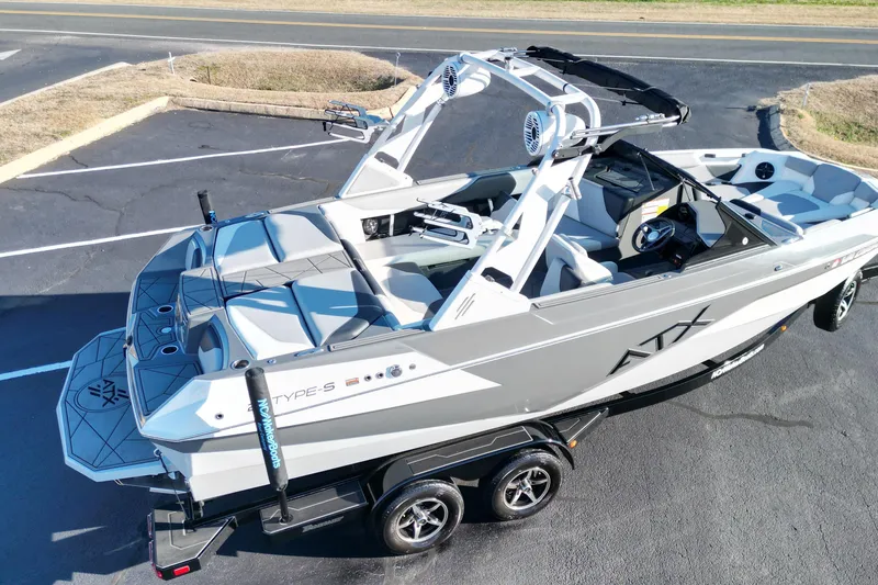 Slide: The Image of 2021 ATX Surf Boats 22 Type-S, sleek design, parked on trailer, ready for adventure. - 8