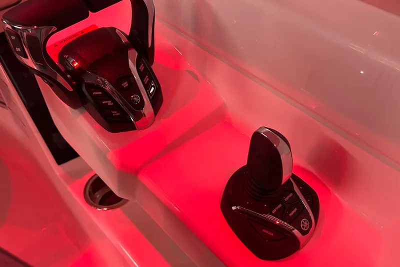 Slide: The Image of Red-lit control panel of 2026 Robalo R257 Dual Console boat. - 11