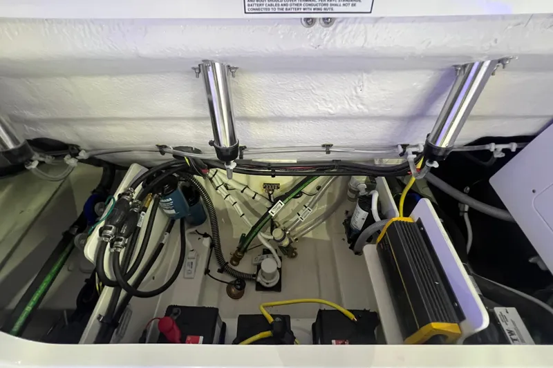 Slide: The Image of 2026 Robalo R257 Dual Console engine compartment with wiring and components. - 20