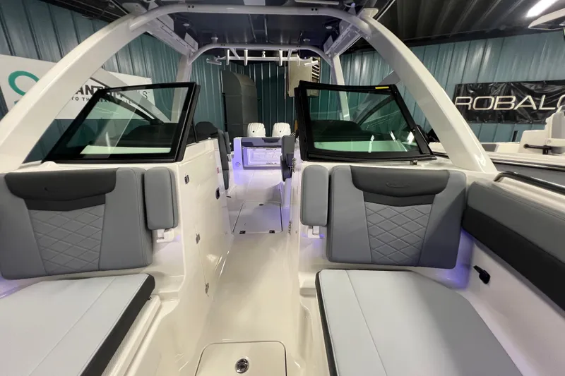 Slide: The Image of 2026 Robalo R257 Dual Console interior with gray seating and modern design. - 25