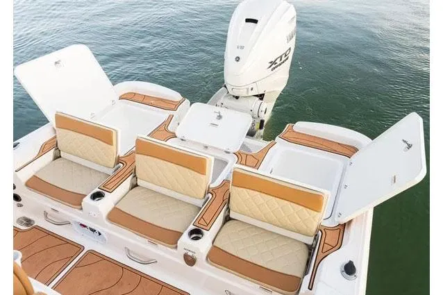 Slide: The Image of Manufacturer Provided Image: 2025 NauticStar 274 Bay boat with luxurious seating and engine. - 10
